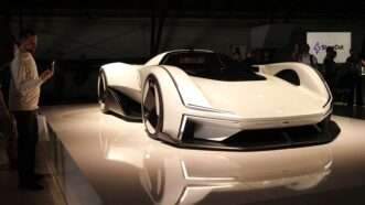 Visitors look at a Polestar electric car at an event in Los Angeles | Zeng Hui / Xinhua News Agency/Newscom