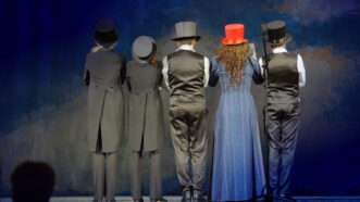 Stage actors with their backs to the audience. | Andrey Lukovskii | Dreamstime.com