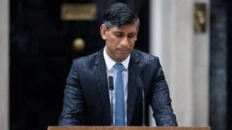 Prime Minister Rishi Sunak makes a statement in the rain outside 10 Downing Street. | Tejas Sandhu/ZUMAPRESS/Newscom